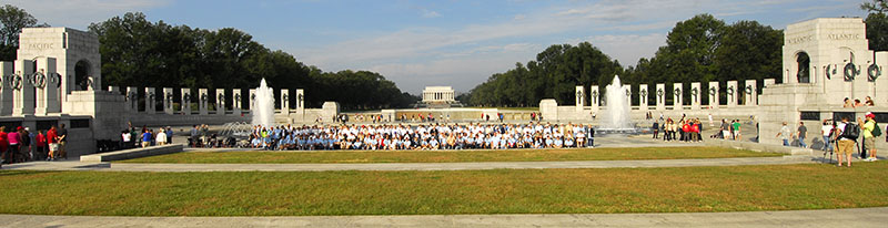 WWII Veterans assembled at the WWII Memorial with the Lincoln Memorial in background
